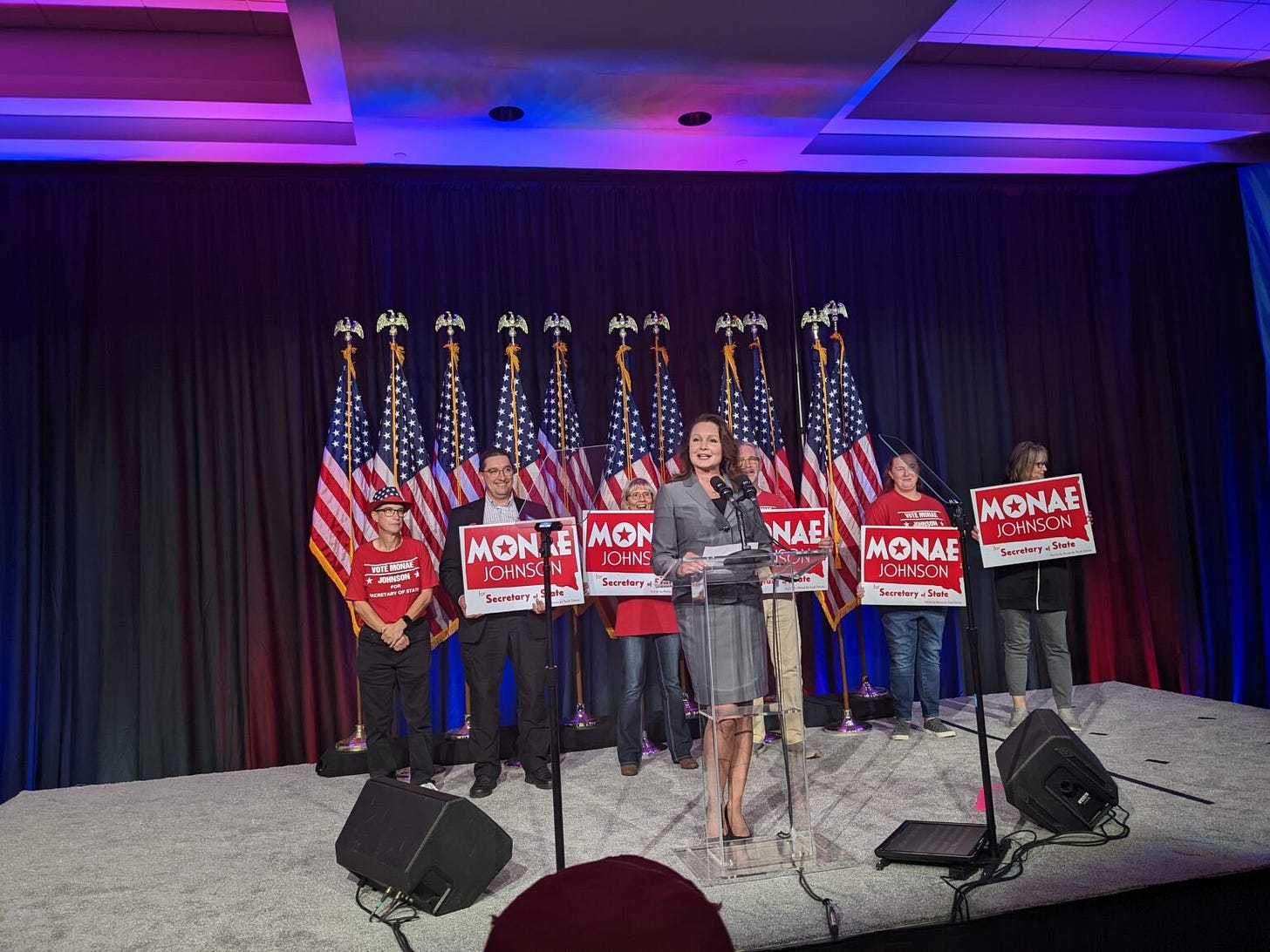 Secretary of State-Elect Monae Johnson celebrates her Nov. 8, 2022, election victory. Behind Johnson (from left) stands her campaign manager, Gretchen Weible, and Weible's husband Rick Weible. (John Hult/South Dakota Searchlight)