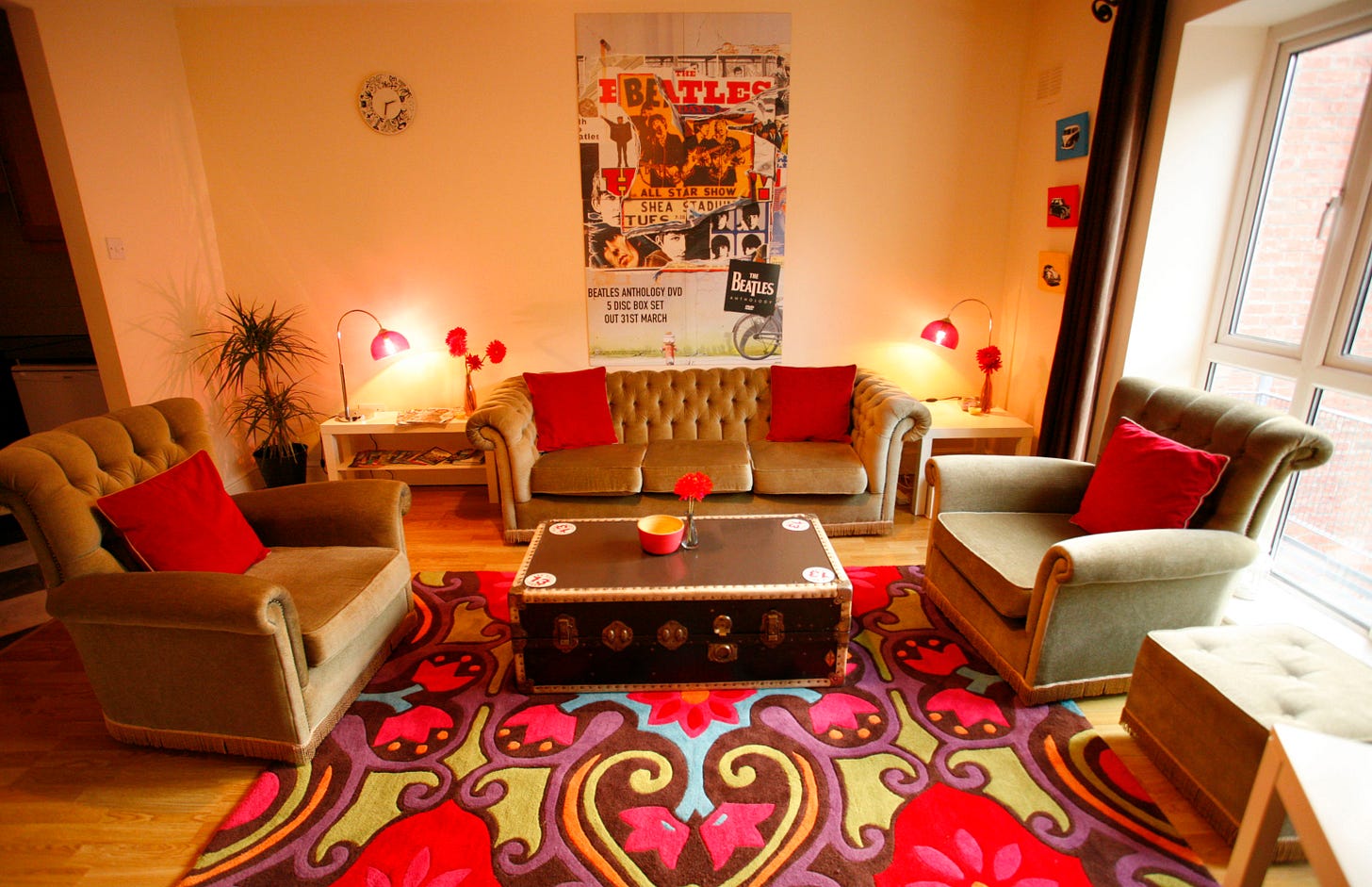 Retro styled Chesterfield sofa, upcycled vintage table and Beatles Poster in Living room
