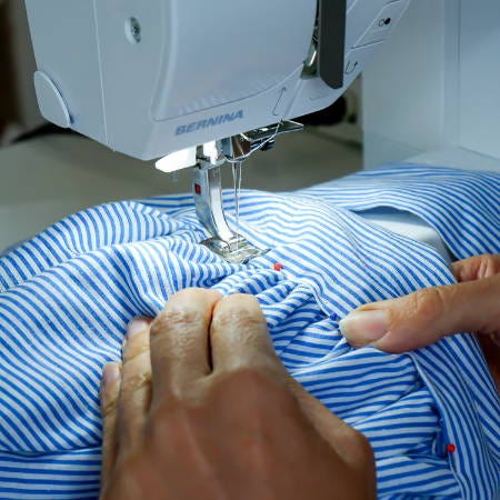 sewing the outer layer of the head band to the gathered bonnet sewing the outer layer of the head band to the gathered bonnet