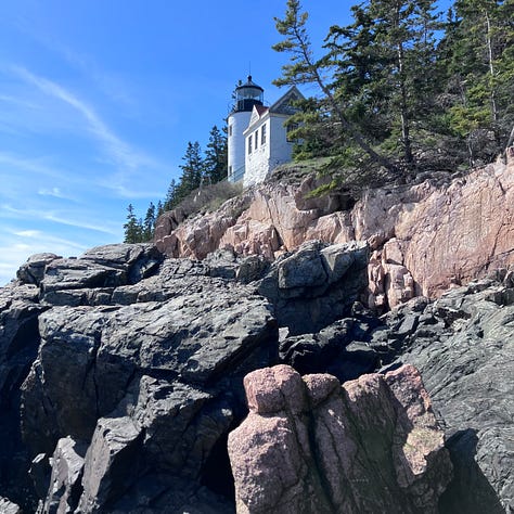 Bass Harbor lighthouse, peaceful blue water, lobster traps