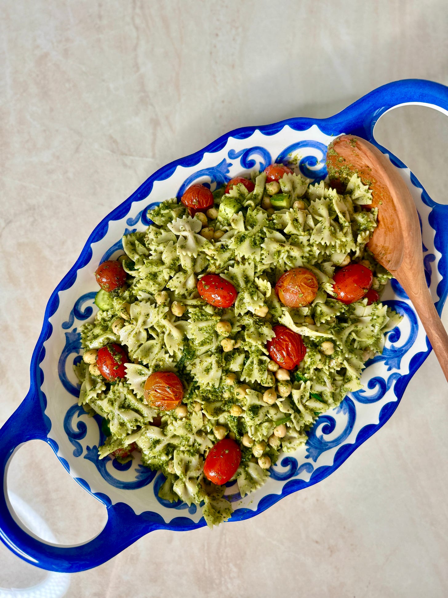 Pesto pasta salad with roasted colorful tomatoes