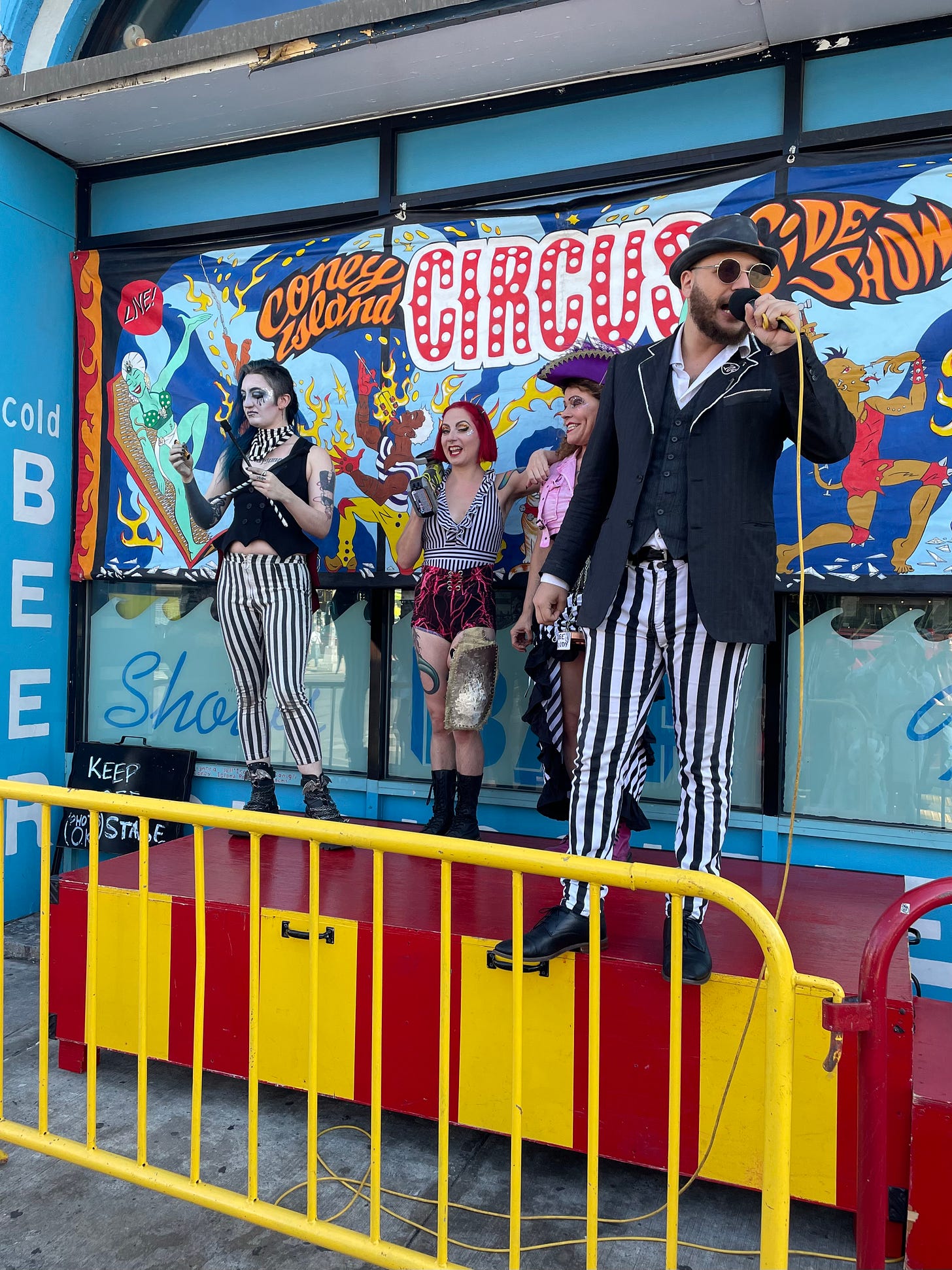 Emcee and sideshow performers