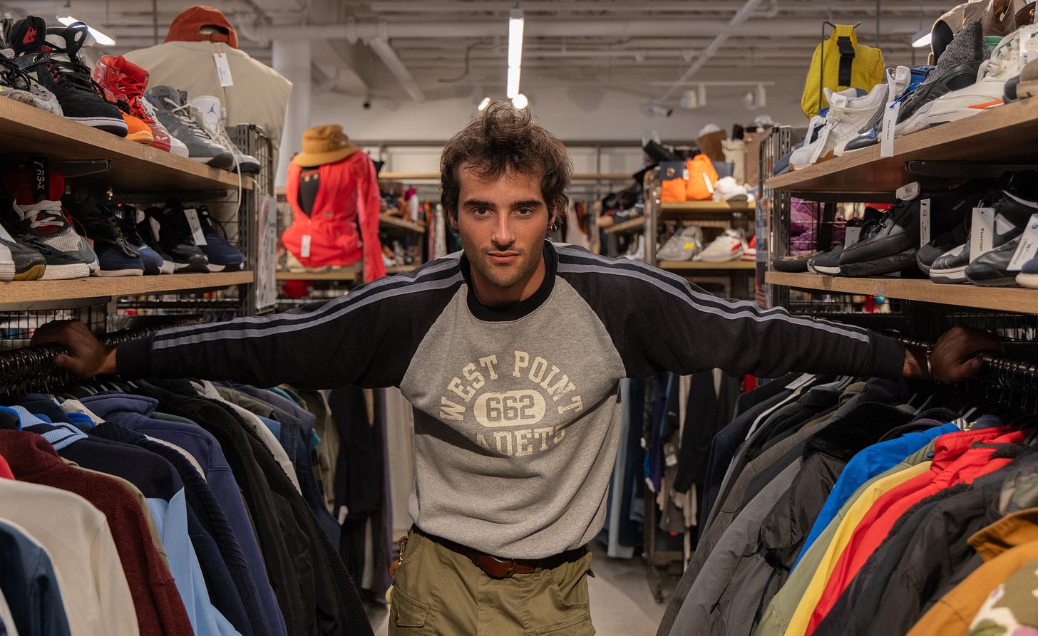 Maximillian Ryan, 21, stands between aisles at 2nd STREET in Torrance on April 9. Ryan is a content creator with 28,000 followers on Instagram. (Angel Pasillas | Warrior Life )