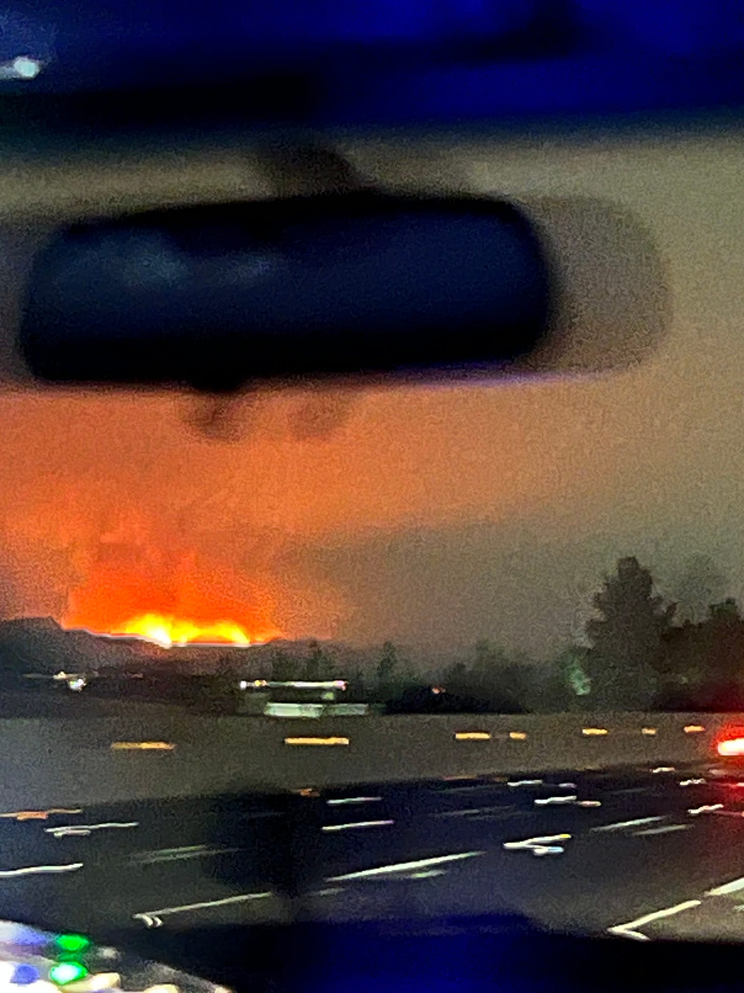 Photo of the LA fires as seen from the passenger seat of a car 