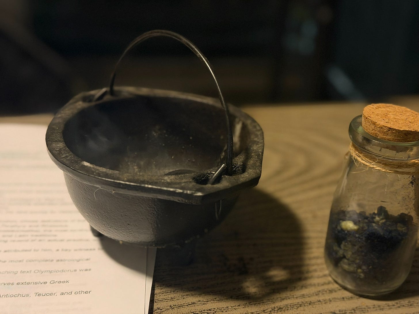 Photo: Cauldron, incense smoke, ancestral list.