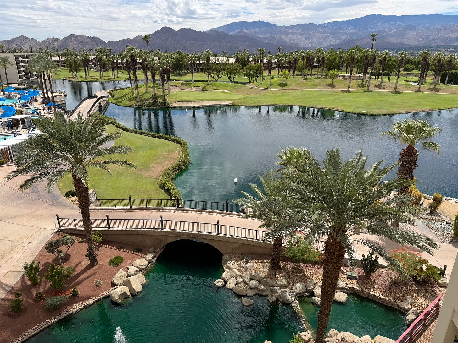 View over the ponds, palm trees, gold course, and mountains at JW Marriott Desert Springs Resort & Spa