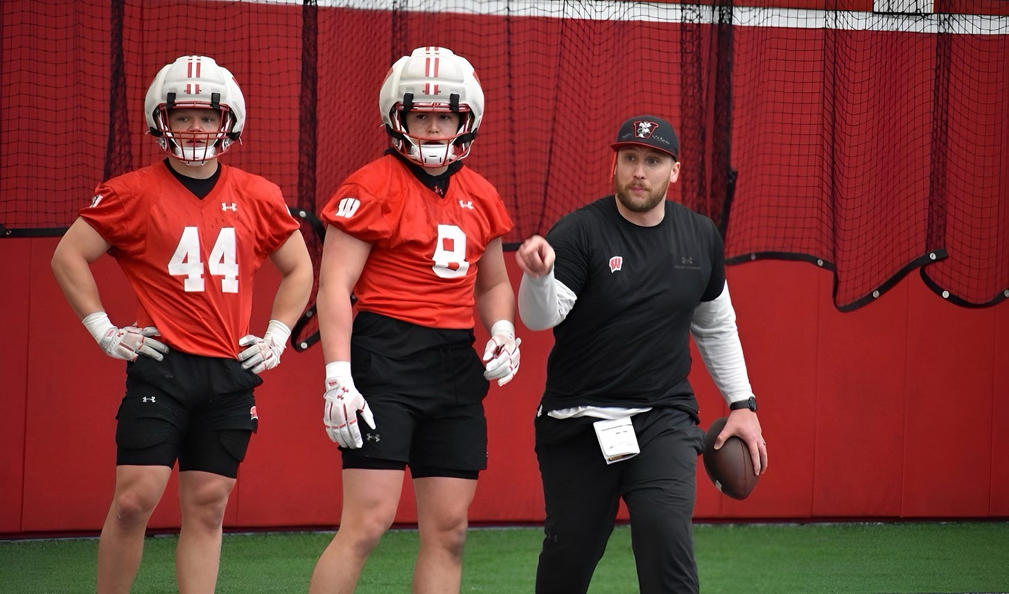 Wisconsin Badgers inside linebackers coach Tuf Borland works with linebackers Mason Posa and Cooper Catalano during practice. Wisconsin Badgers inside linebackers coach Tuf Borland works with linebackers Mason Posa and Cooper Catalano during practice.