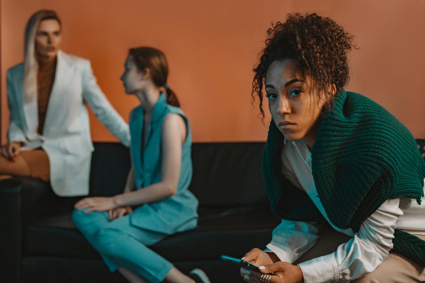 Woman Sitting Separately from Other Models Woman Sitting Separately from Other Models
