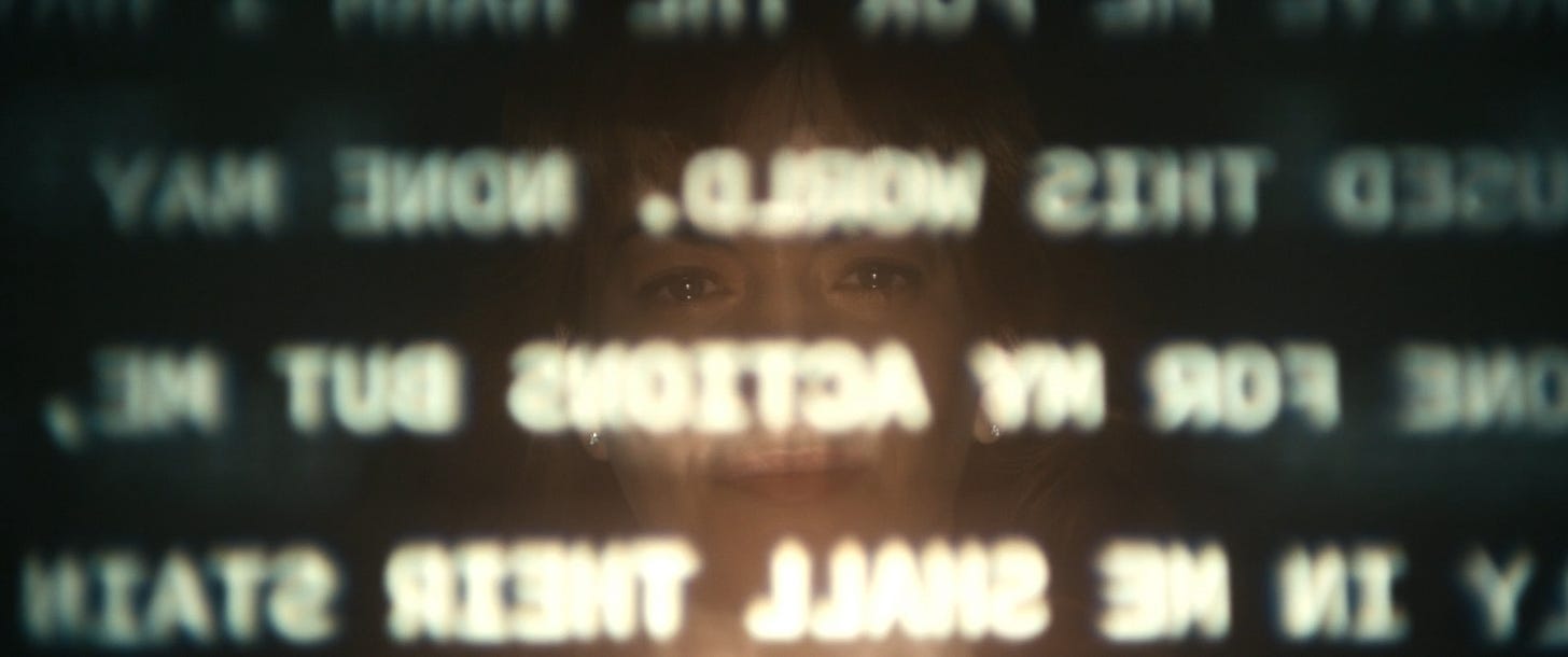 Helly staring at the text she reads in the break room from season 1