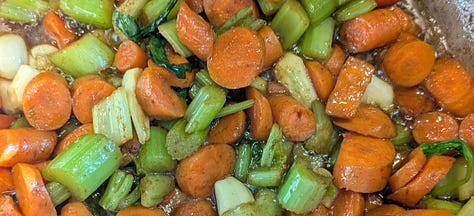 Browned meats. Carrots and celery softening.