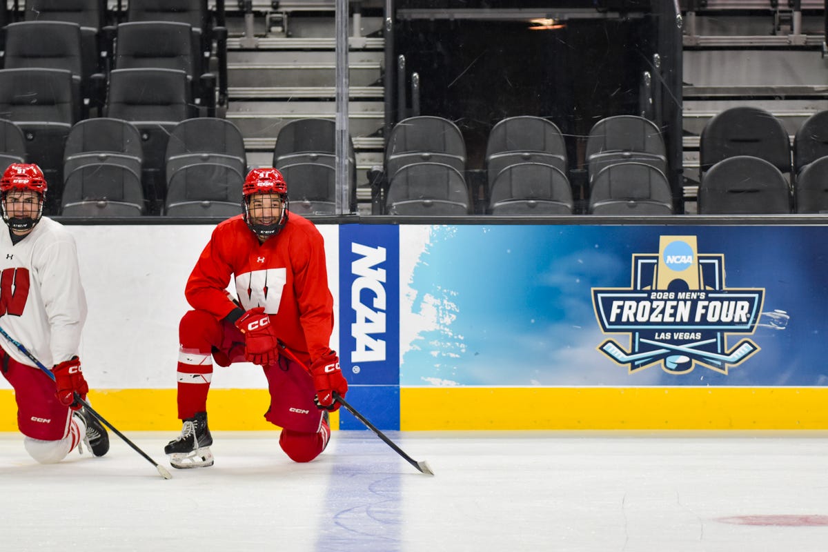 Bruno Idžan and Blake Montgomery left knee and stick on ice.