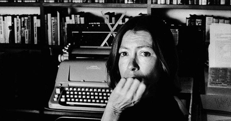 This may contain: black and white photograph of a woman in front of an old typewriter with her mouth open
