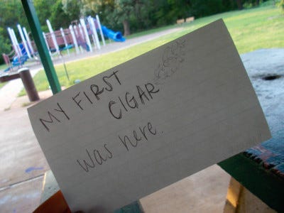 a gallery of photos which contain 17-year-old Ari's hand holding flashcards in front of various locations. each flashcard reads "this is where I..." and is completed with the memory associated with the location