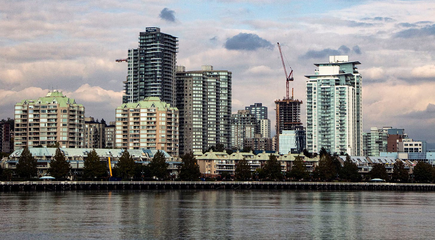 Photo of downtown new westminster. a series of towers, highrises and mid-rises stand over the fraser river. Photo of downtown new westminster. a series of towers, highrises and mid-rises stand over the fraser river.
