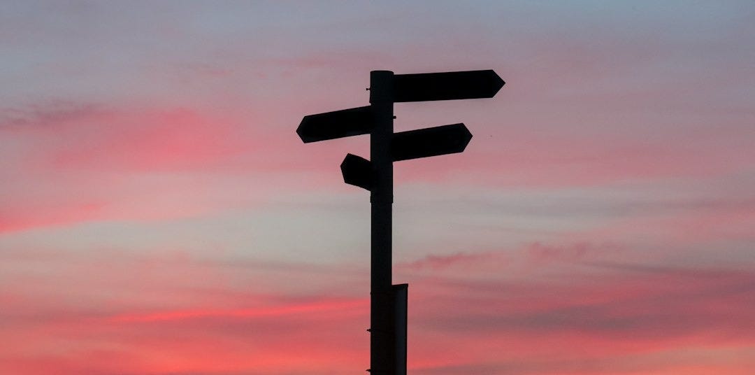 silhouette of a road signage during golden hour