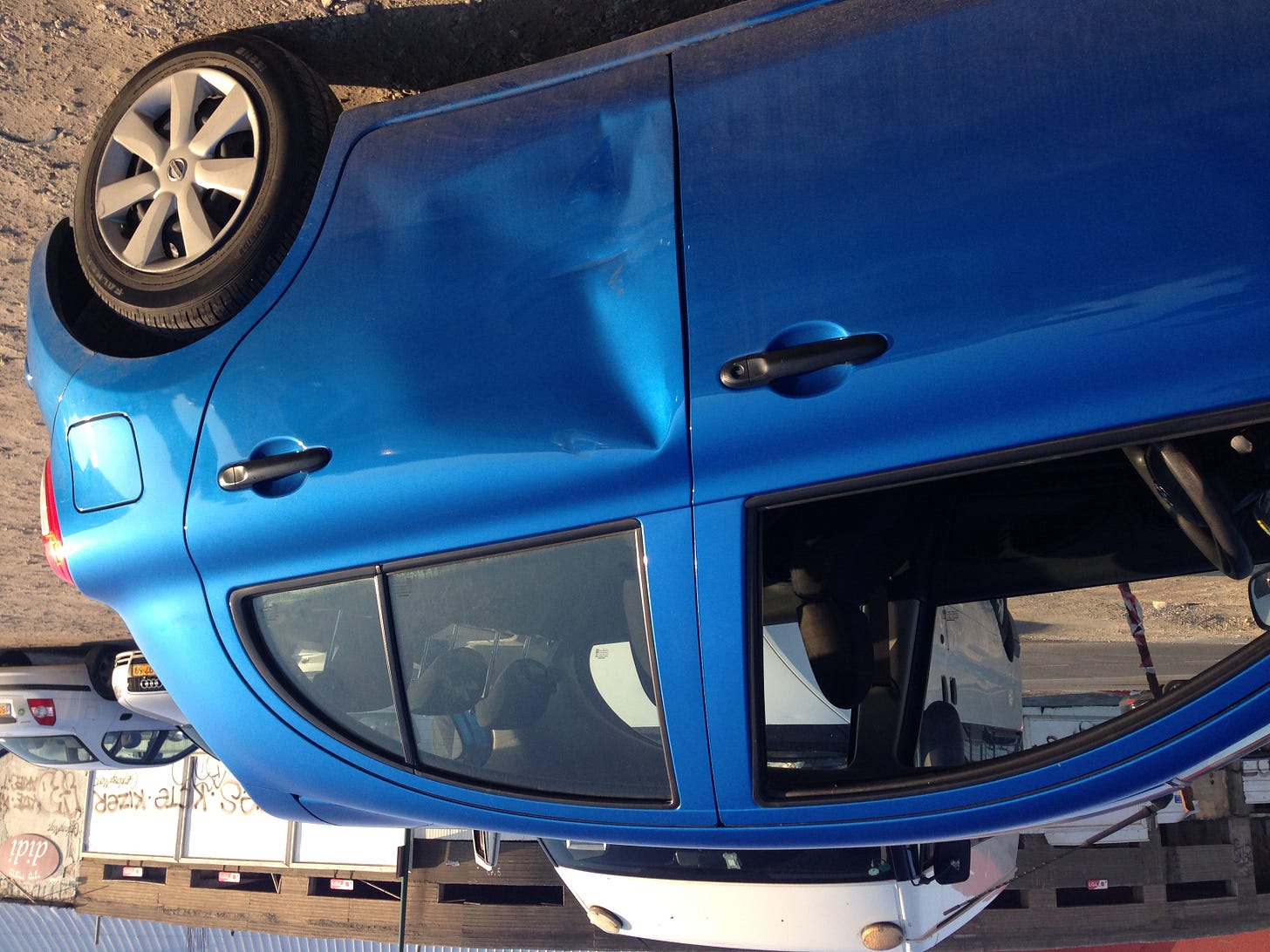 Noooooooo. Hamid, you asshole!  The Nissan.  You didn't hear me honking???