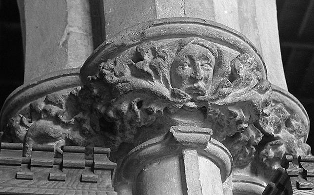 A medieval Green Man on the capital of a column in an English church in Lincolnshire A medieval Green Man on the capital of a column in an English church in Lincolnshire
