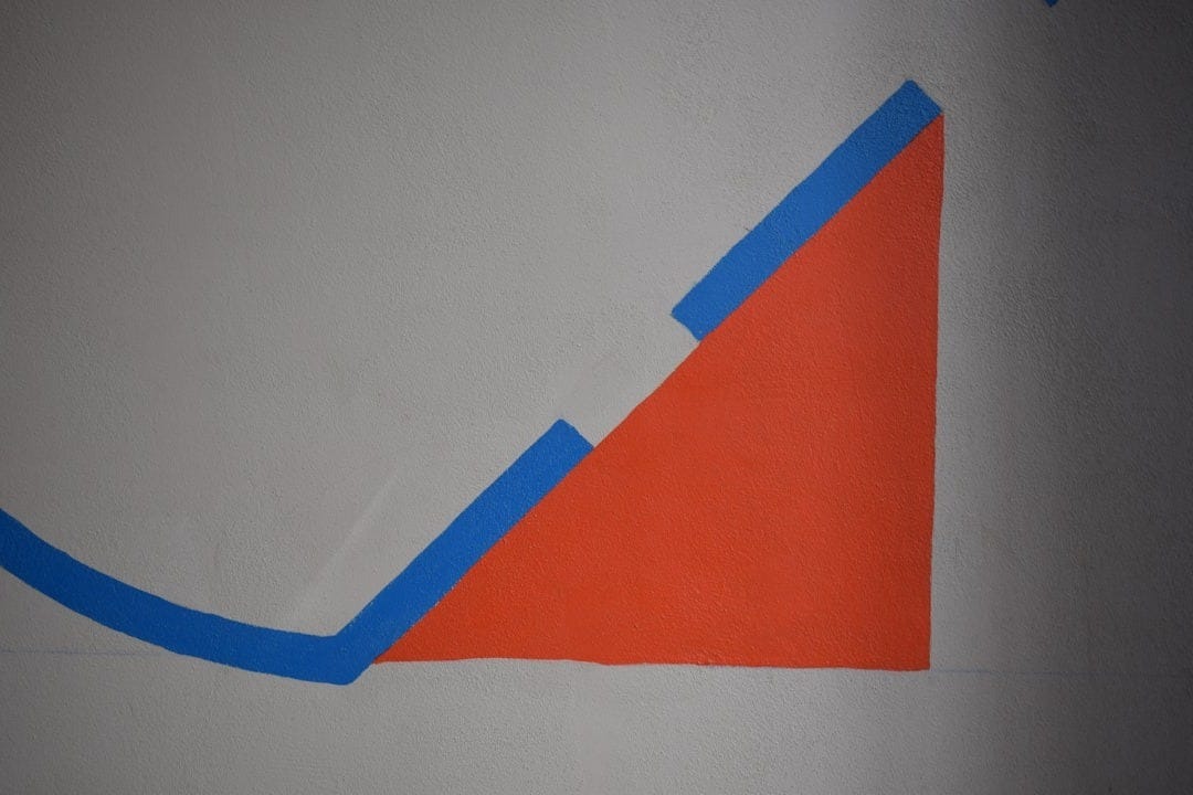 a drawing of a triangle on a white wall a drawing of a triangle on a white wall