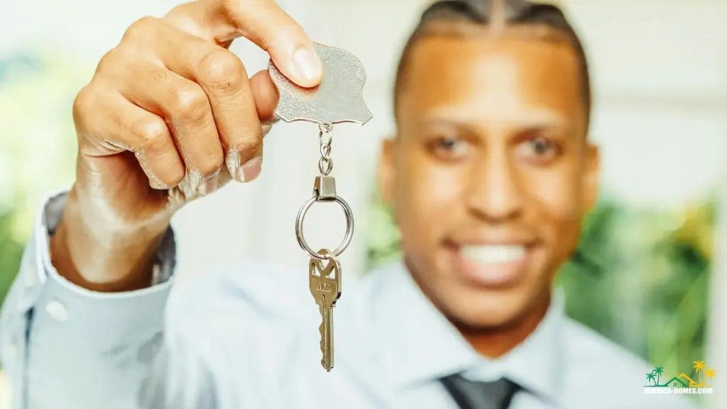man in white dress shirt holding a silver key