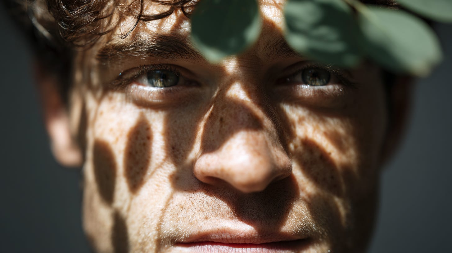 A handsome man, his face illuminated by the dappled sunlight filtering through leaves, which forms geometric patterns over his eyes and mouth. This is a portrait photograph, captured with a Hasselblad X2D camera. --ar 16:9 --profile 5nv9sv3 --v 7 A handsome man, his face illuminated by the dappled sunlight filtering through leaves, which forms geometric patterns over his eyes and mouth. This is a portrait photograph, captured with a Hasselblad X2D camera. --ar 16:9 --profile 5nv9sv3 --v 7
