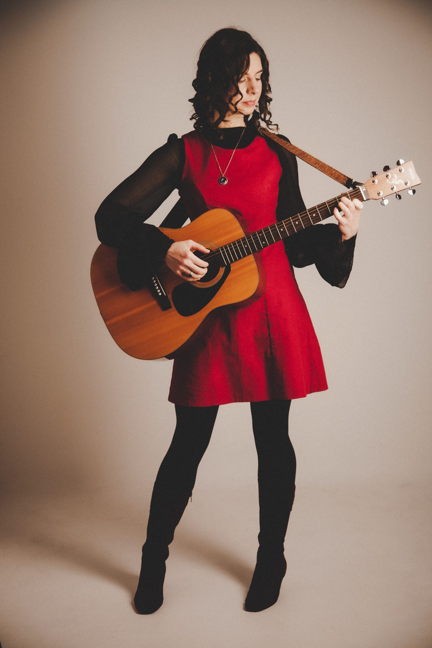 Danielle Styles holding a Yamaha acoustic guitar Danielle Styles holding a Yamaha acoustic guitar
