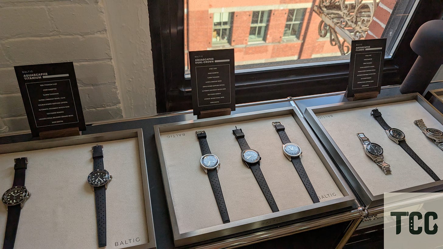 Watches in the foreground, and another building with a downward perspective in the background.