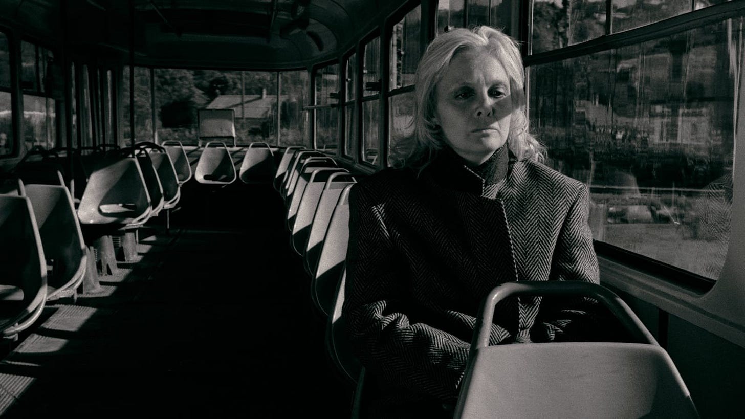 The Asthenic Syndrome | Still features a woman on an empty bus. The Asthenic Syndrome | Still features a woman on an empty bus.
