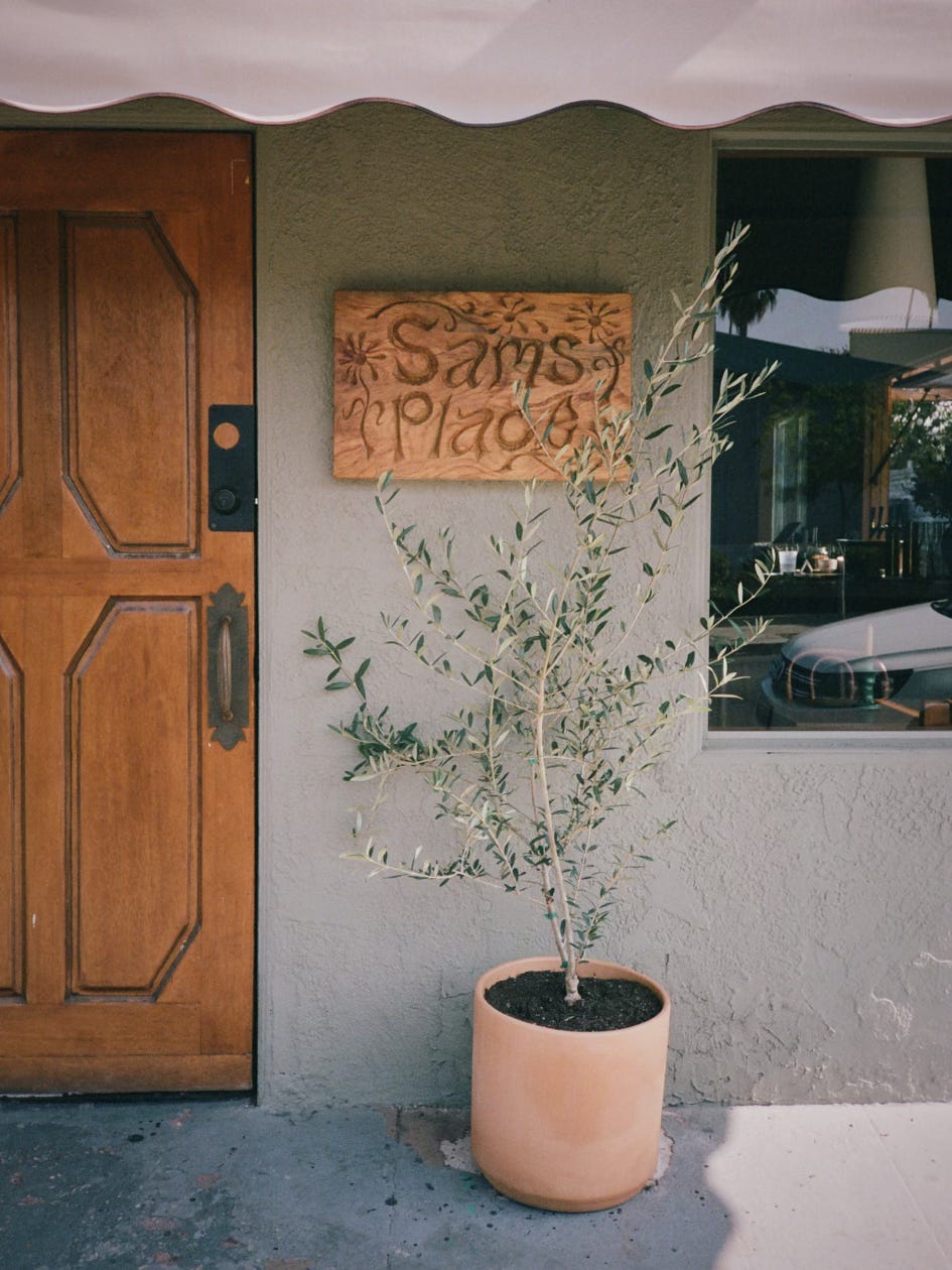 Sam's Place plaque by Nik Gelormino