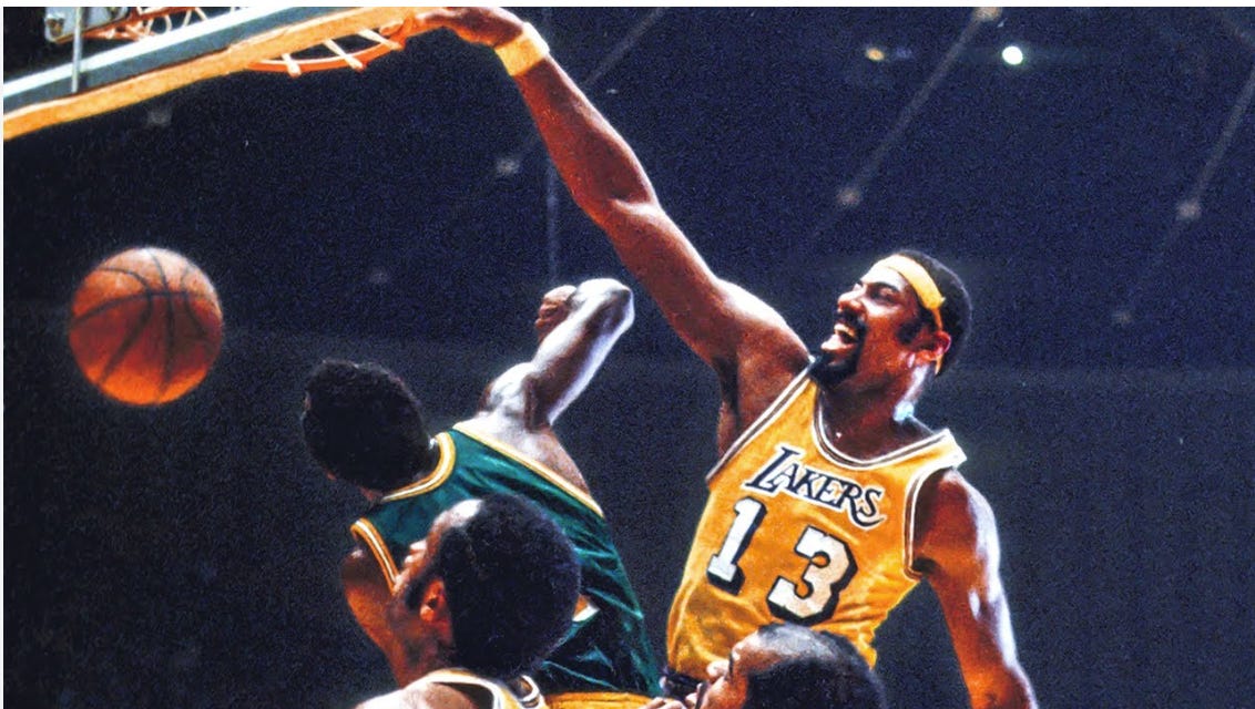 A Lakers player, likely Kobe Bryant, is dunking a basketball over a defender in an intense NBA game.
AI-generated content may be incorrect. A Lakers player, likely Kobe Bryant, is dunking a basketball over a defender in an intense NBA game.
AI-generated content may be incorrect.