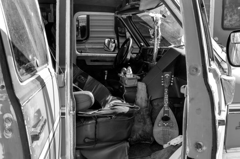 View from front passenger seat doorway of VW camper interior showing musical instruments. View from front passenger seat doorway of VW camper interior showing musical instruments.