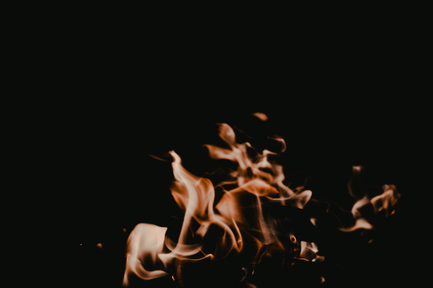 Painting of fire in a dark room
