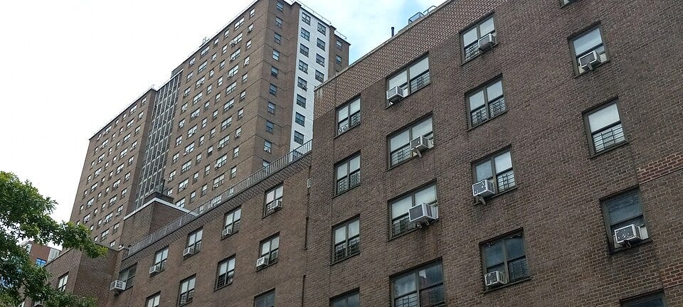 Red-brick towers of the NYCHA Fulton Houses in Chelsea, Manhattan, viewed across their grounds. Red-brick towers of the NYCHA Fulton Houses in Chelsea, Manhattan, viewed across their grounds.