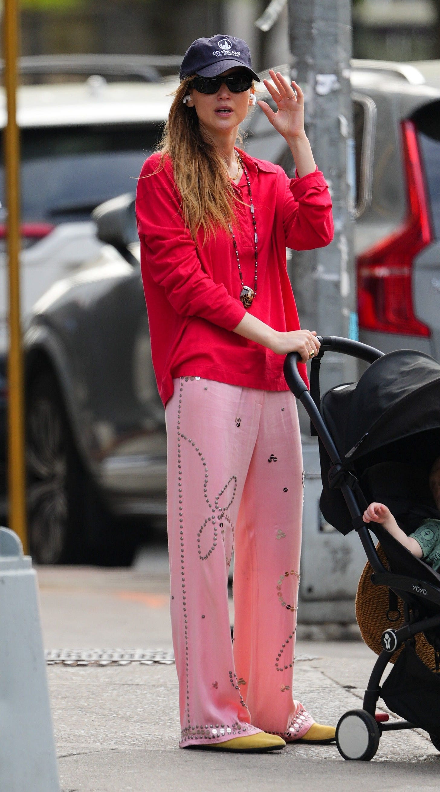 New York NY Actress Jennifer Lawrence brightens the NYC streets as she strolls with her baby in a red buttonup shirt and... New York NY Actress Jennifer Lawrence brightens the NYC streets as she strolls with her baby in a red buttonup shirt and...