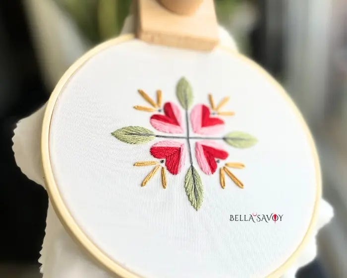 Heart Flower Embroidery Stitch Along 77 hooped fabric with a cute heart flower embroidery design for the stitch along