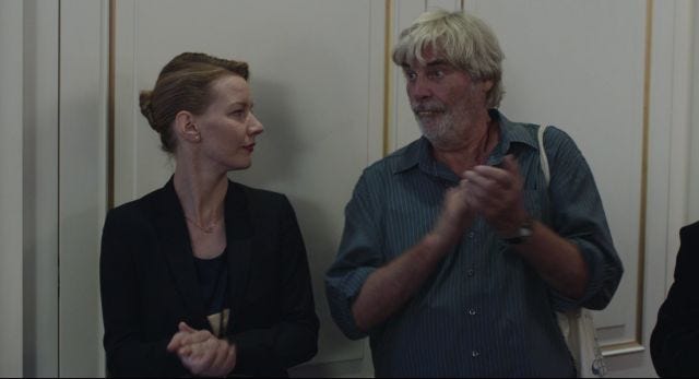 Woman gives scolding look to white-haired man with fake teeth Woman gives scolding look to white-haired man with fake teeth