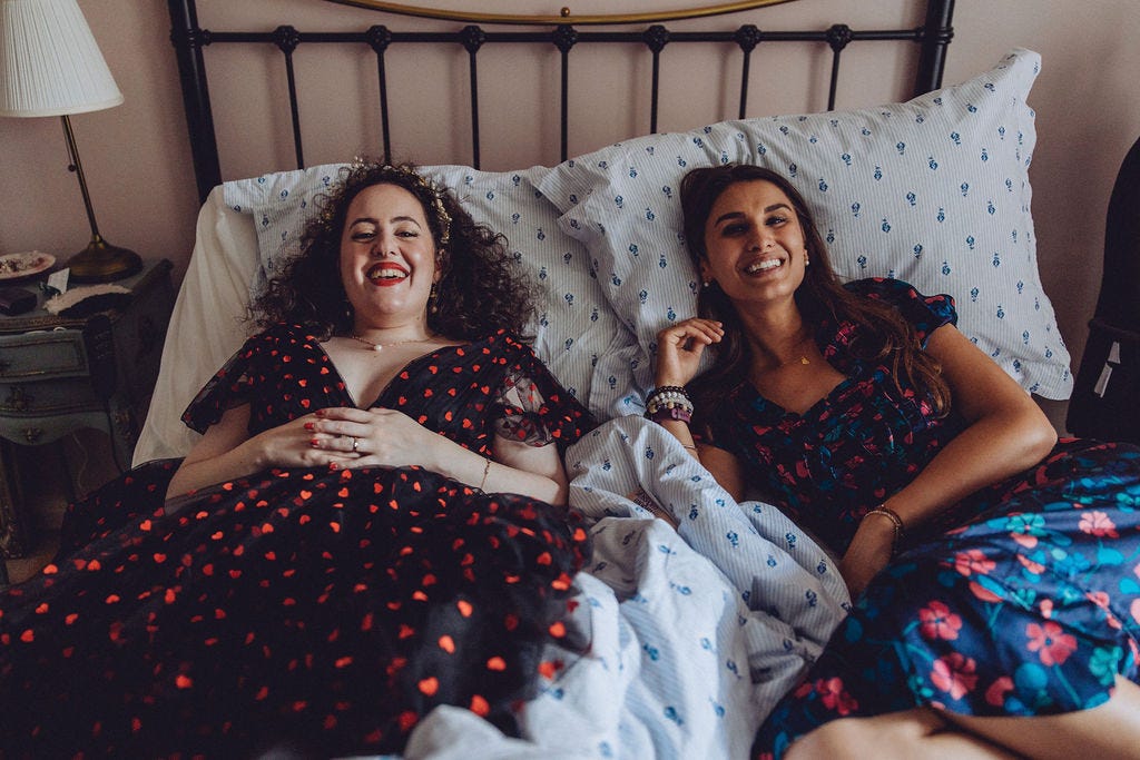 Natasha and her friend Natasha resting in bed
