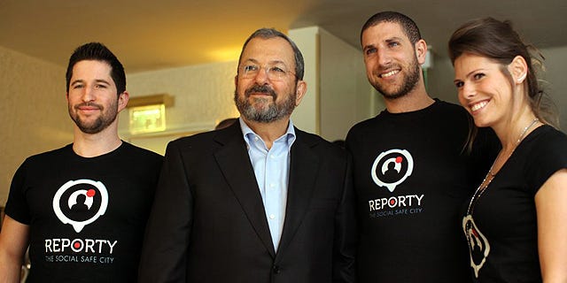  .Ehud Barak with the founders of Reporty, which was rebranded as Carbyne. Photo: Amit Sha