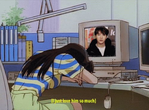 This may contain: a woman is looking at a computer screen while wearing sunglasses and leaning over her head