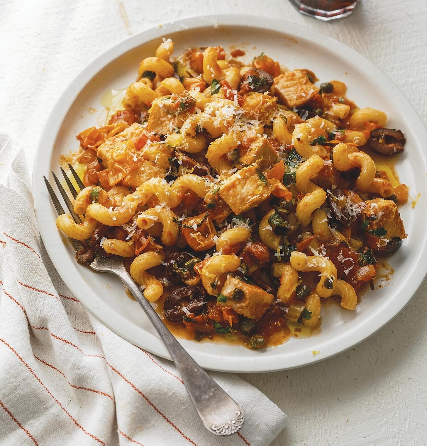 Plate of swordfish cavatappi with a fork.