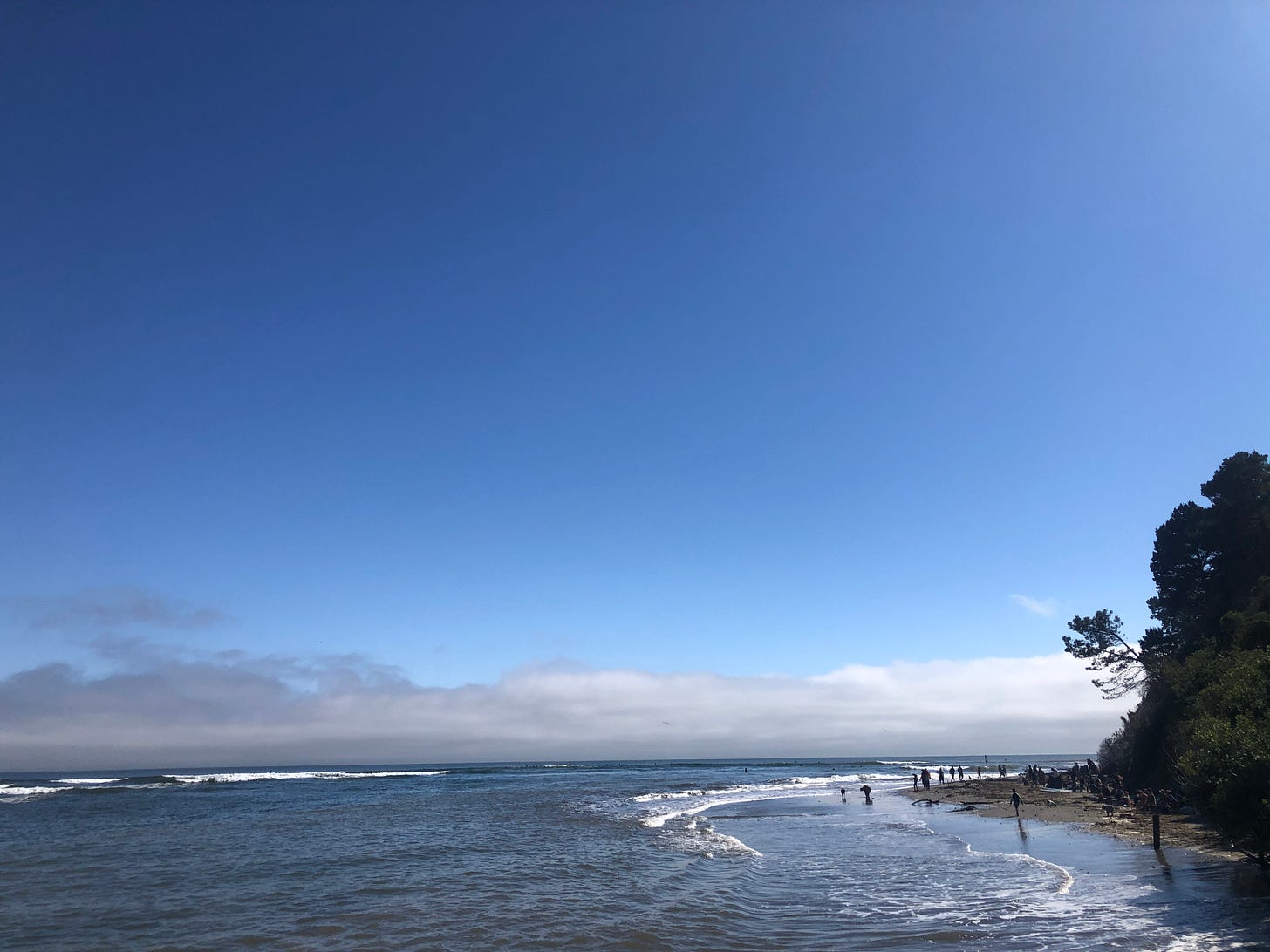 Shoreline with clouds in the background.