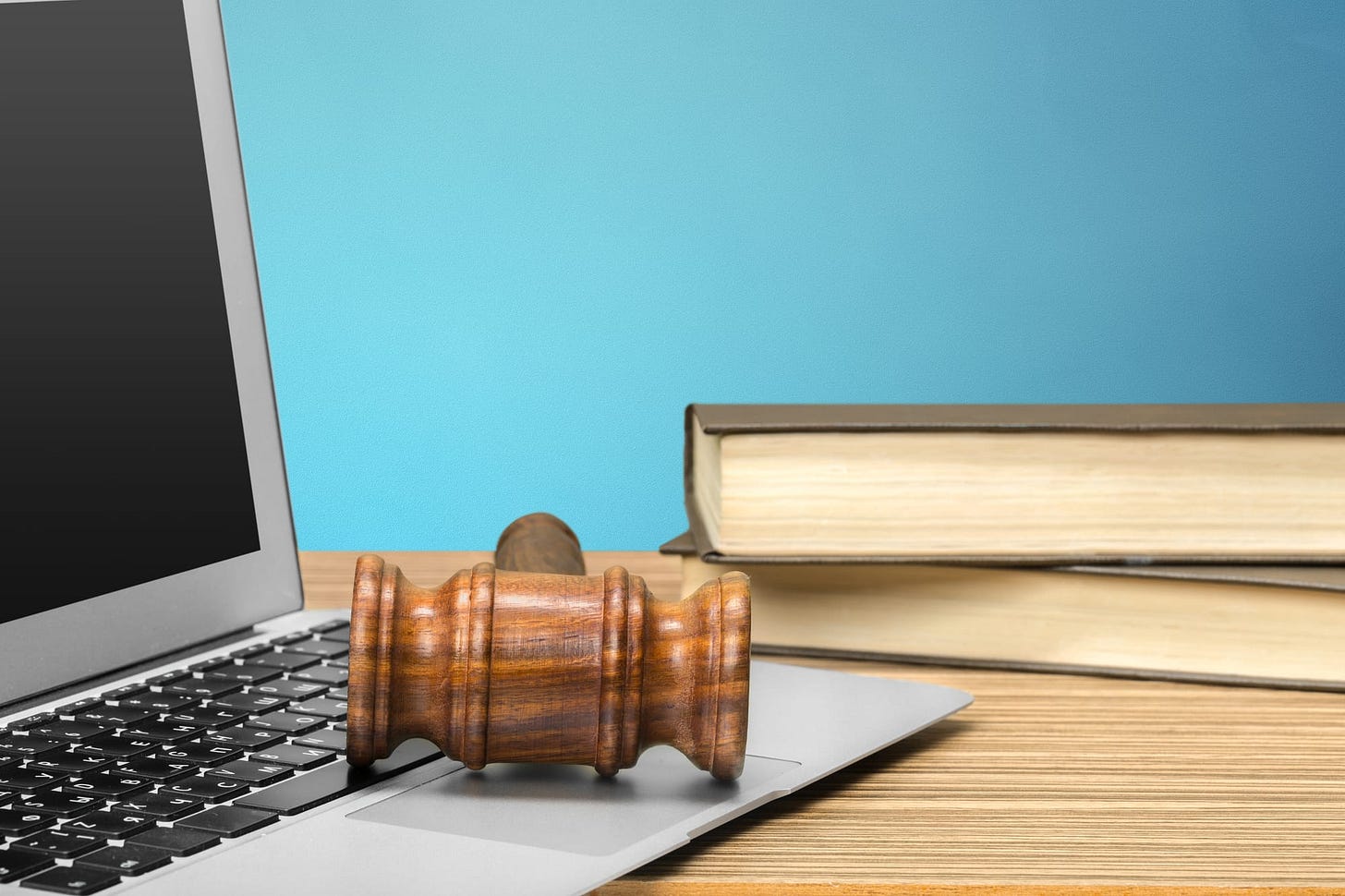 Computer, books, and judge’s gavel