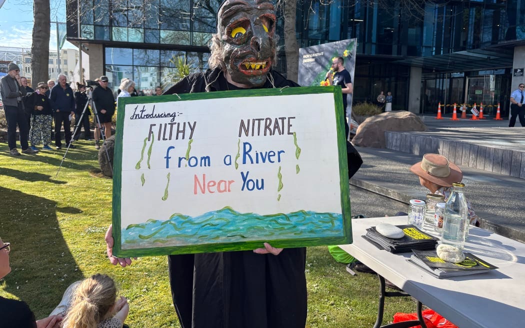 Protesters outside the Canterbury Regional Council offices demand action on nitrate levels. Protesters outside the Canterbury Regional Council offices demand action on nitrate levels.