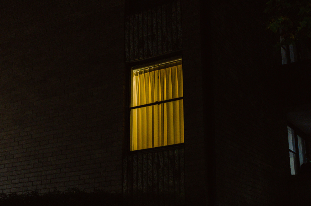 A lighted window at night A lighted window at night