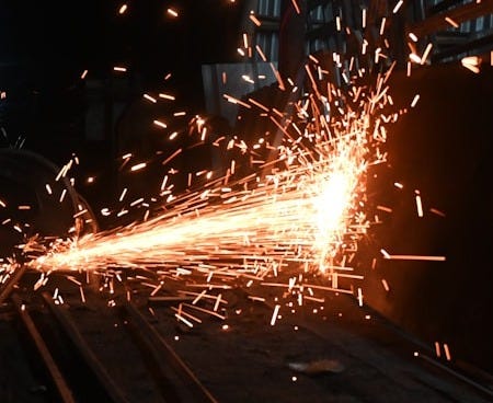 A man working on a piece of metal