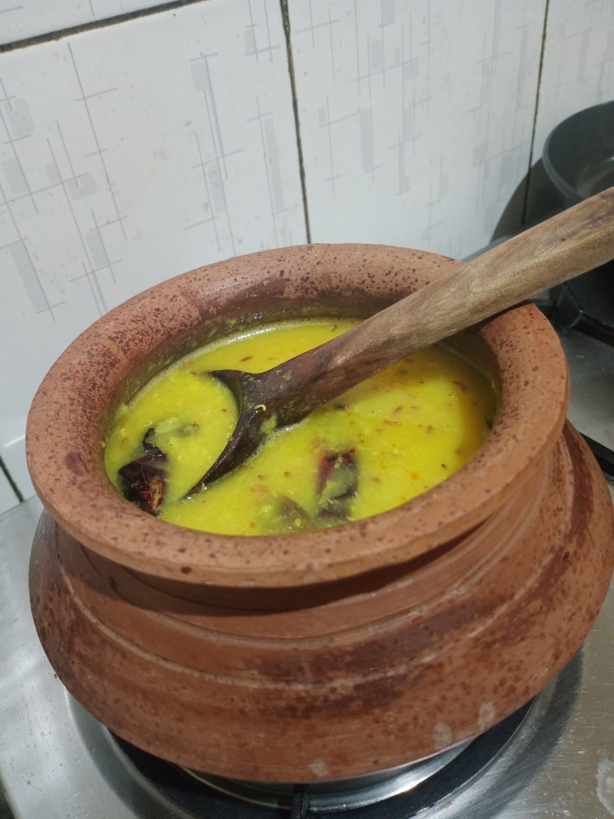 Urad dal on stove near the end of cooking