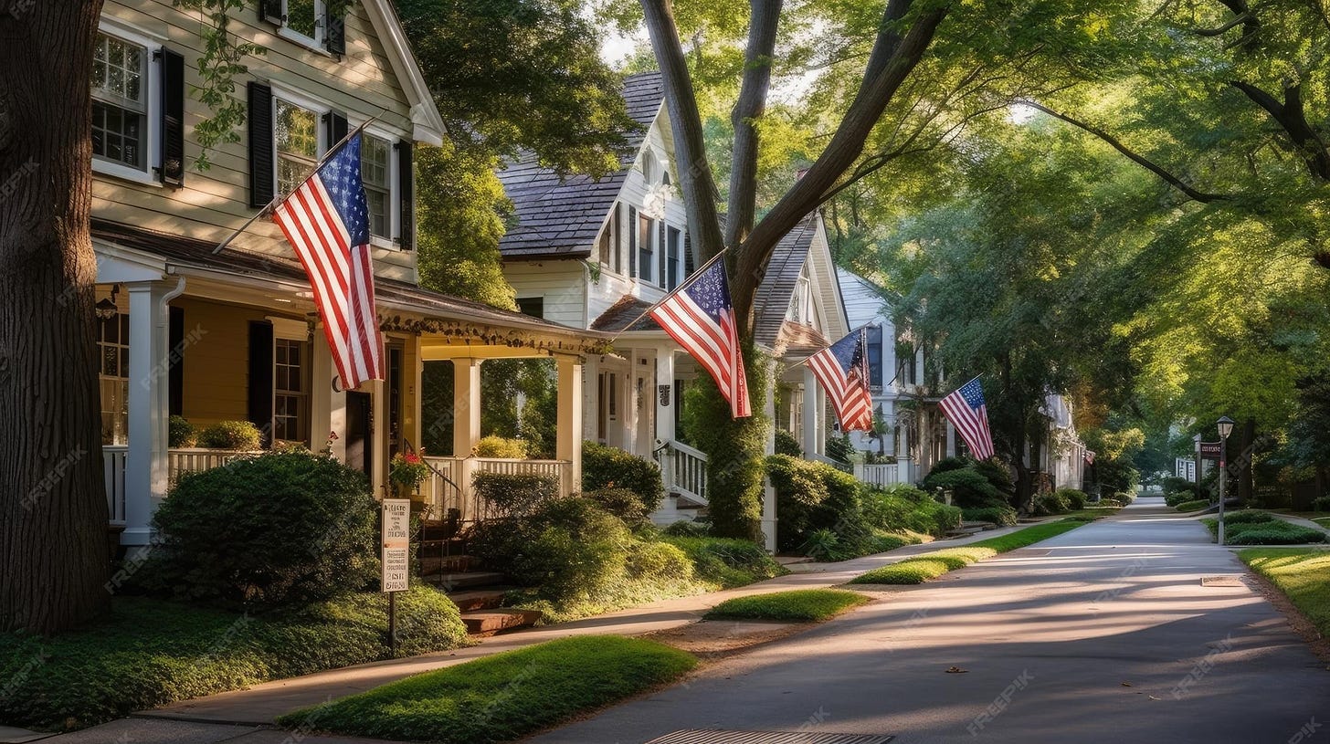 A row of homes with american flags on the front and a porch with a tree ... A row of homes with american flags on the front and a porch with a tree ...