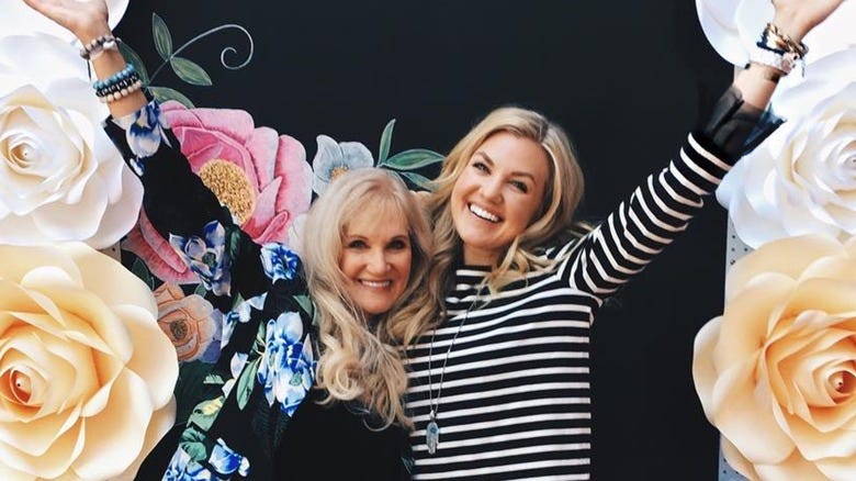 Lori Frantzve Erika Kirk smiling hands in the airThis isn’t just a family photo. It’s the chain of custody: Superfeed → Lori → Erika → TPUSA.