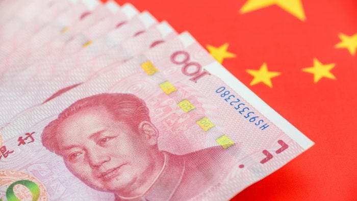 Money / currency of PBOC or people's bank of china. One hundred CNY Chinese yuan bill with a flag of China. 100 rmb or renminbi, depicts Beijing economy system, public banking policy and interest rate