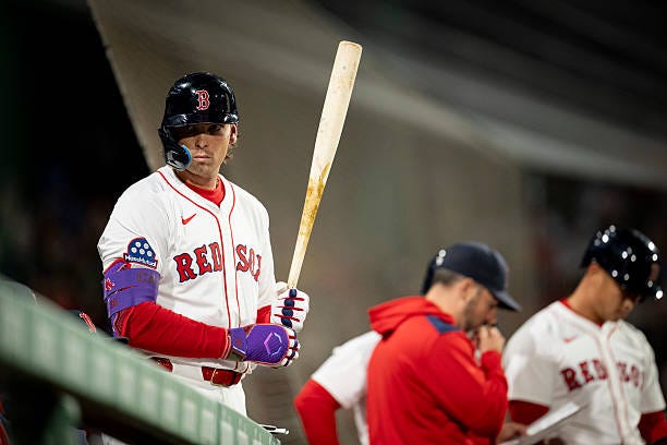 Triston Casas of the Boston Red Sox looks on from the dugout during the seventh inning of game two of a doubleheader against the St. Louis Cardinals...