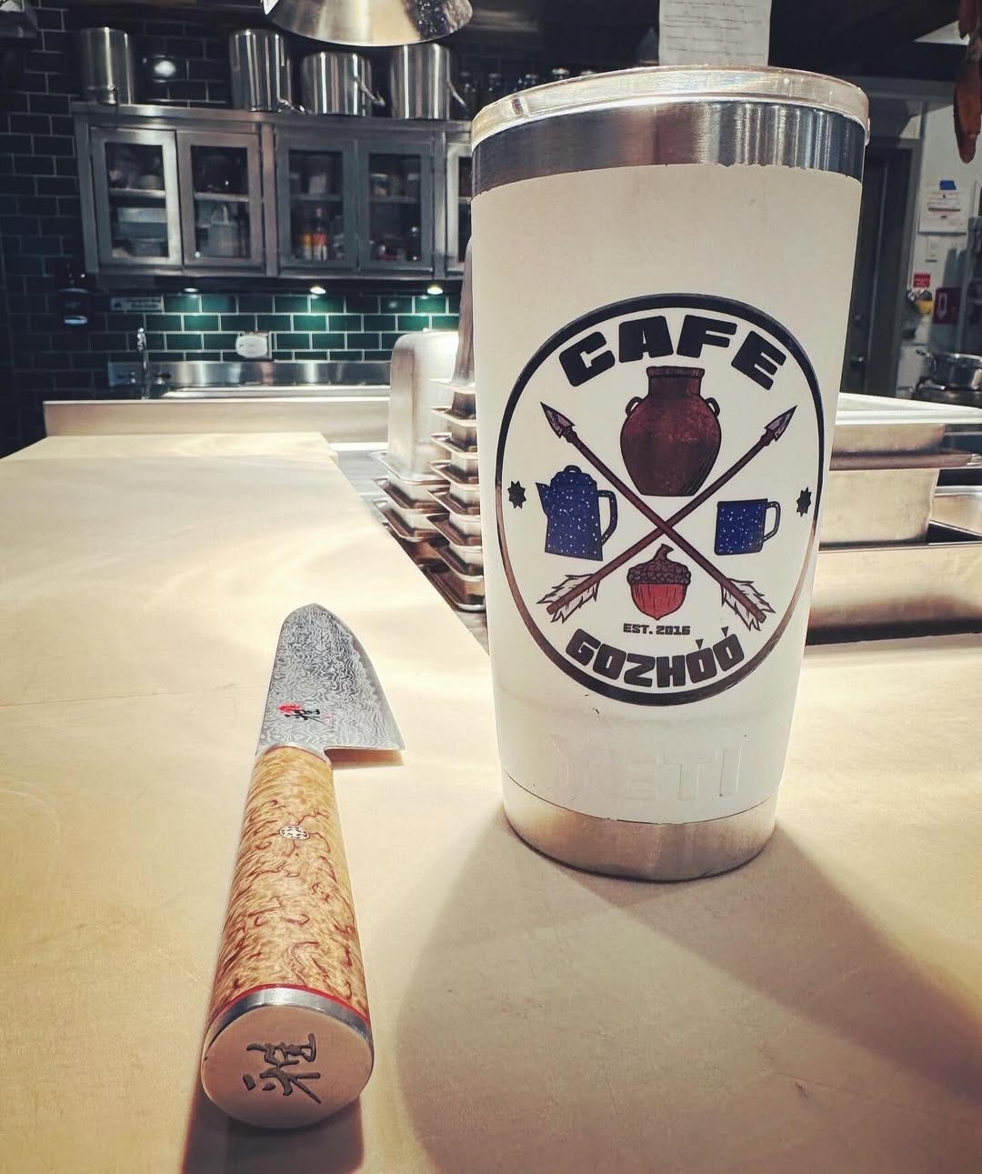 a tumbler of coffee from Cafe Gozhóó - Rainbow Treatment Center Nutritional Recovery Program
